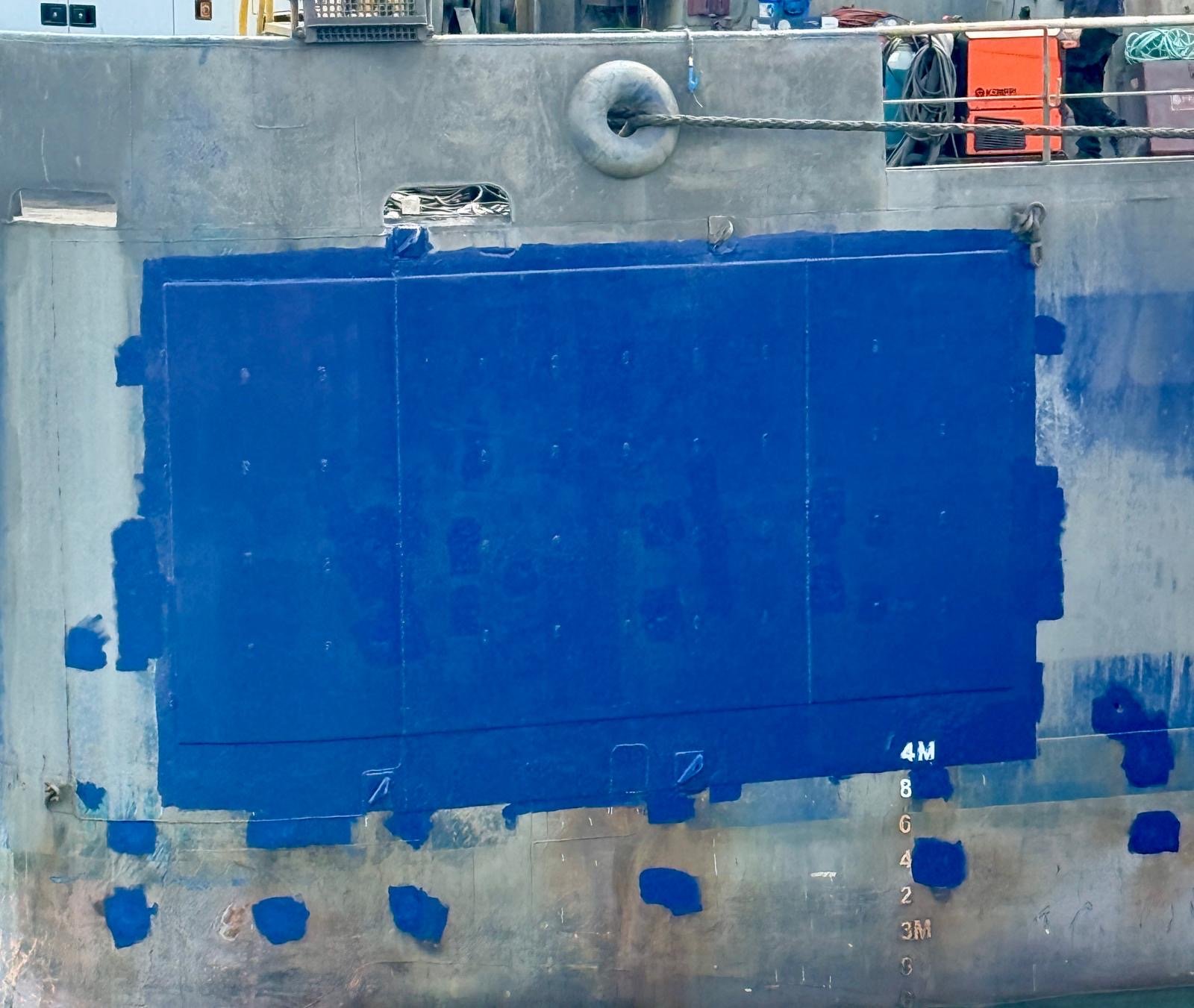 Completed hull doubler plate repair on a ship's port quarter at Bing Bong, Northern Territory, freshly topcoated in blue