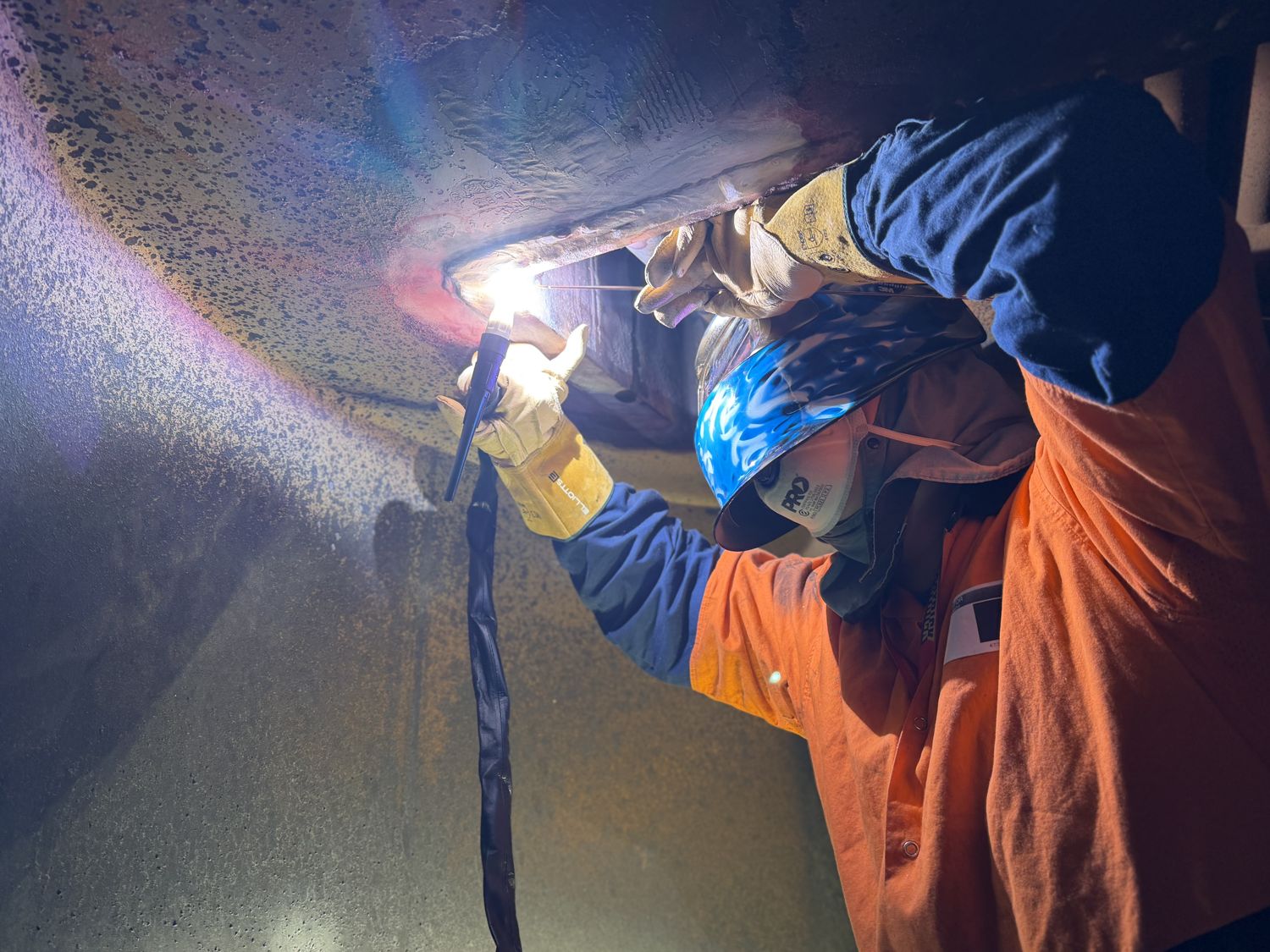 Class-approved TIG welding inside a marine boiler carried out afloat